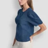 Camisa con mangas abullonadas y fruncido en la parte delantera