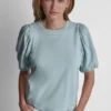 Camiseta con mini volantes y tachuelas Camiseta con mini volantes y tachuelas