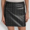 Falda de imitación de cuero con adornos Falda de imitación de cuero con adornos