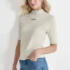 Jerséis con cuello alto y logotipo Jerséis con cuello alto y logotipo