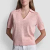 Jerséis con cuello polo y logotipo de pedrería Jerséis con cuello polo y logotipo de pedrería