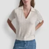 Jerséis con cuello polo y logotipo de pedrería Jerséis con cuello polo y logotipo de pedrería