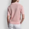 Jerséis con cuello polo y logotipo de pedrería Jerséis con cuello polo y logotipo de pedrería