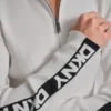 Jerséu de manga larga con cremallera de 1/4 y cinta con el logotipo Jerséu de manga larga con cremallera de 1/4 y cinta con el logotipo