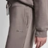 Pantalones cortos de talle alto con logotipo metálico en burbujas Pantalones cortos de talle alto con logotipo metálico en burbujas