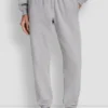 Pantalones jogger de talle alto con logo universitario de pedrería en relieve con corte holgado