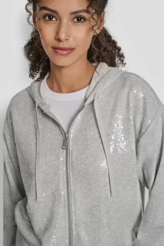 Sudadera con capucha y cremallera con lentejuelas