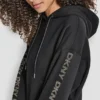 Sudadera con capucha y logo de pedrería en las mangas con corte holgado Sudadera con capucha y logo de pedrería en las mangas con corte holgado
